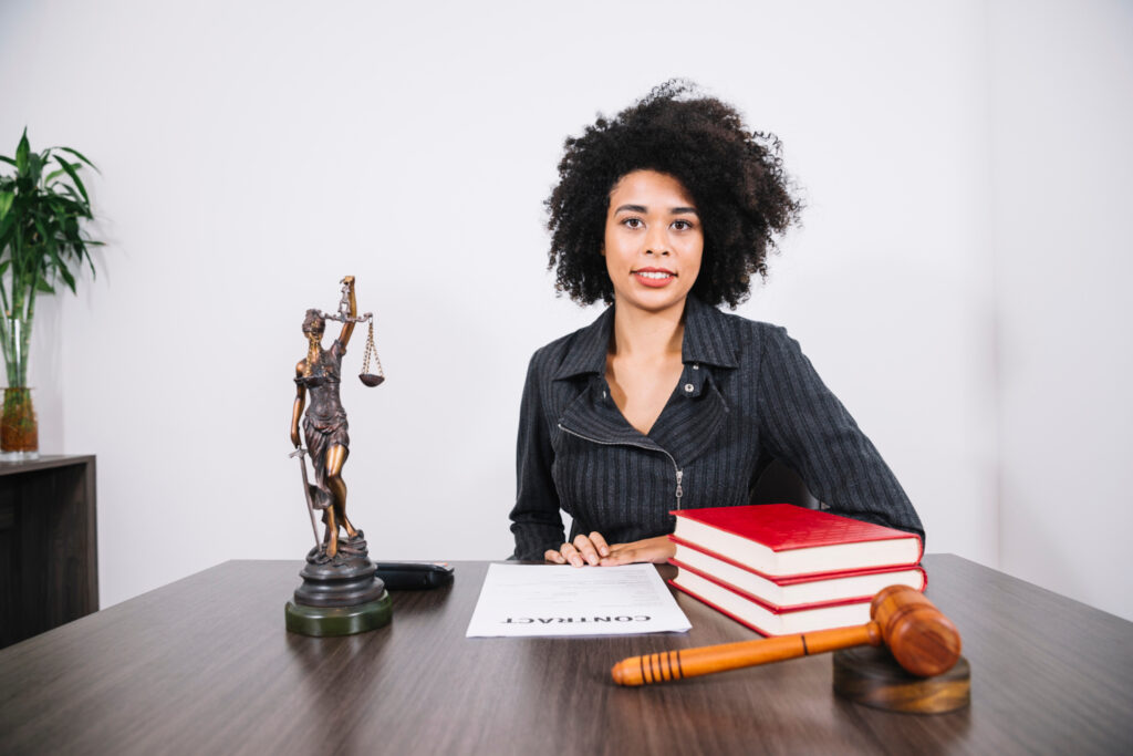 Lawyer at table with books, document and figure