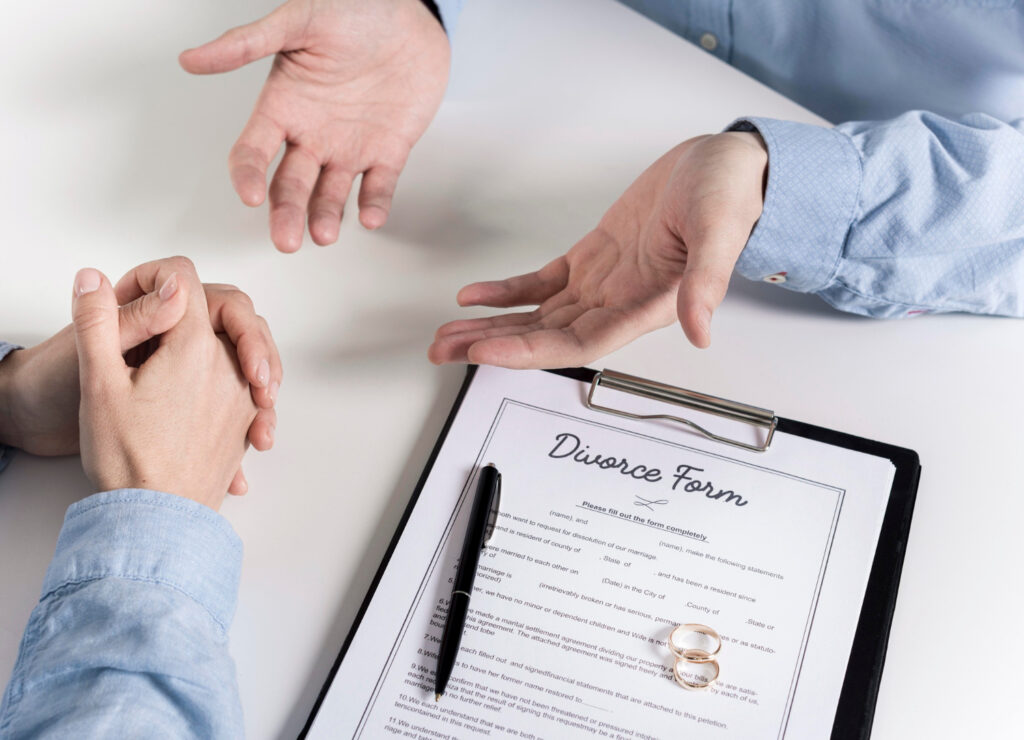 Couple discussing before signing divorce form