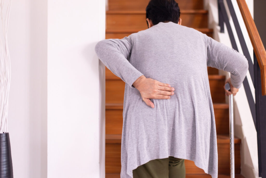 Woman suffering from low-back pain