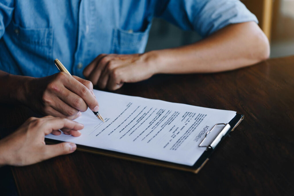 Man signing the agreement