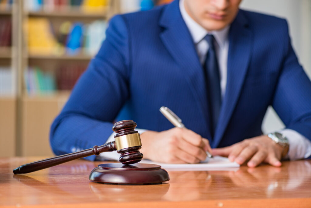 Judge with gavel sitting in courtroom