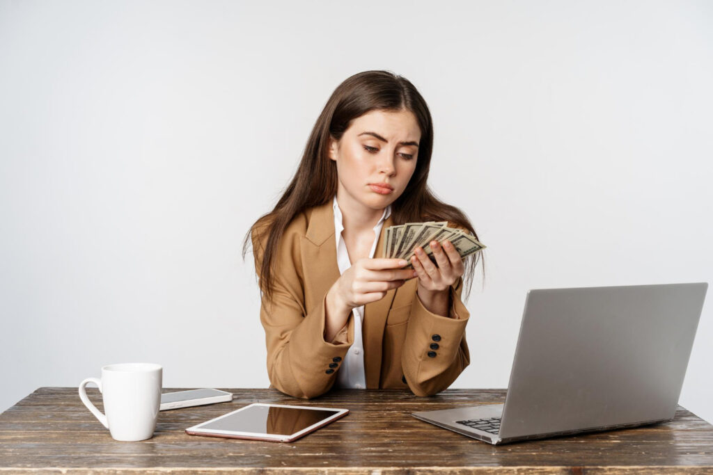 Lawyer counting money in office