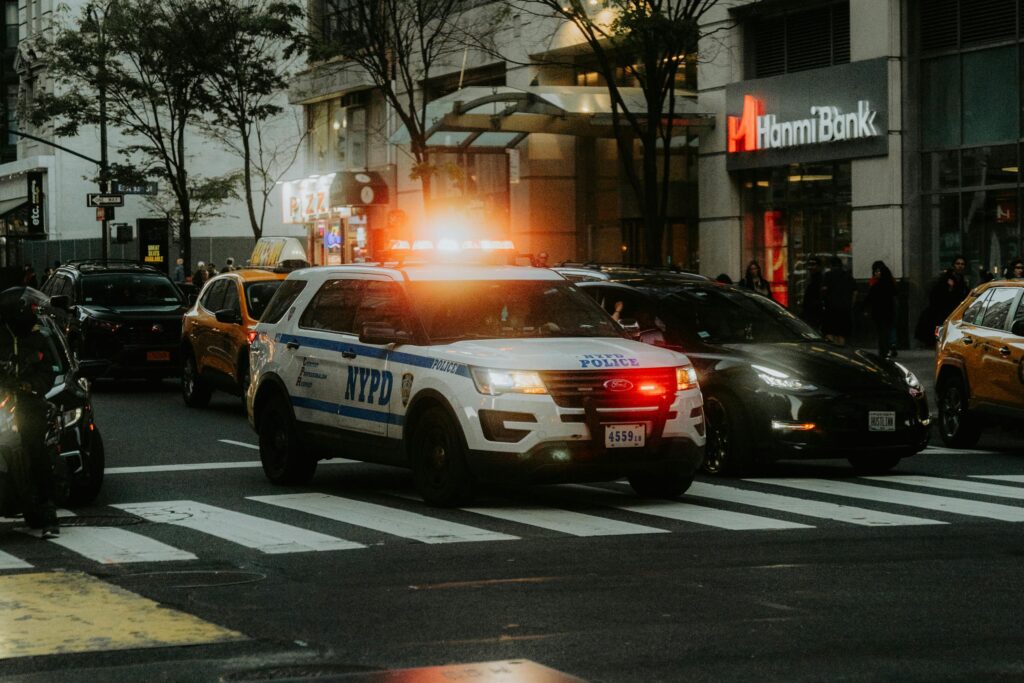 A police car is driving down the street